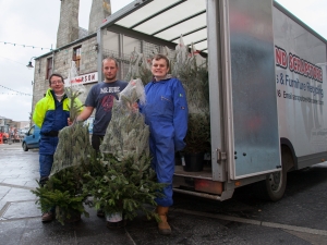 Photo: Fiona Sutherland, Magni Einarsson and Gareth Leishman of COPE Ltd delivering Christmas trees. Image by Ben Mullay