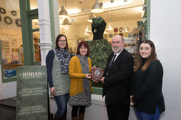 Ninian receive trophy from Living Lerwick